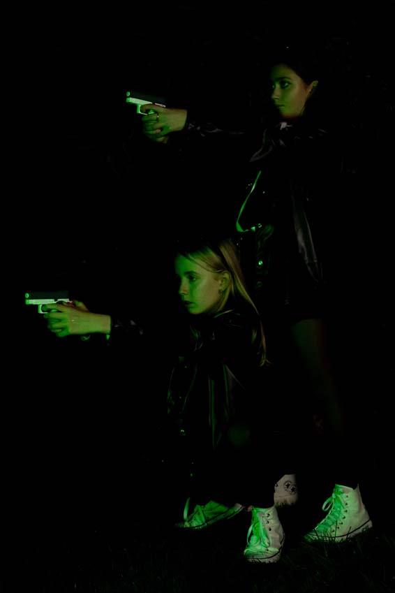 Special lighting effects for these girls shooting guns in their halloween costumes