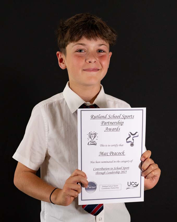 Rutland School Sports Partnership awards evening at Greetham Valley with a primary boy here with his certificate