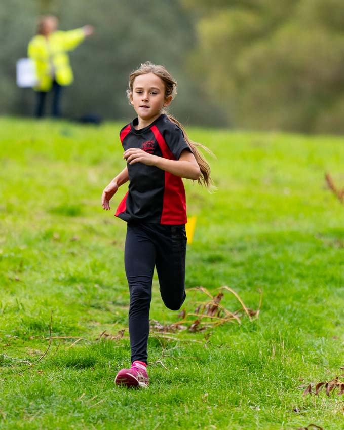 Primary school girl competing at the Rutland Water cross country championships