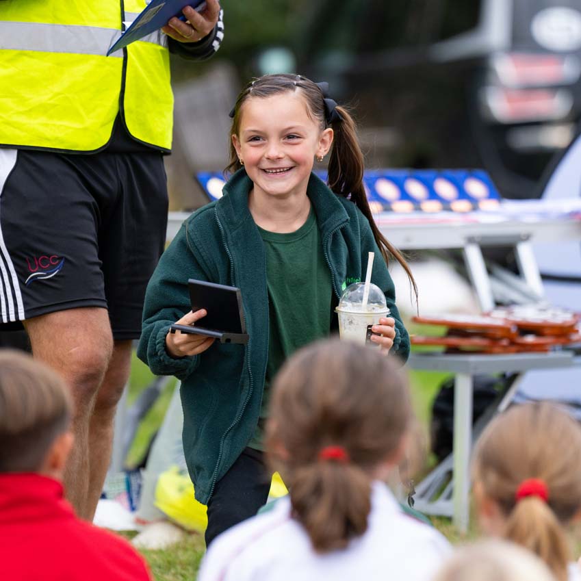 Leighfield primary school girl very pleased to win an award at the Rutland cross country championships