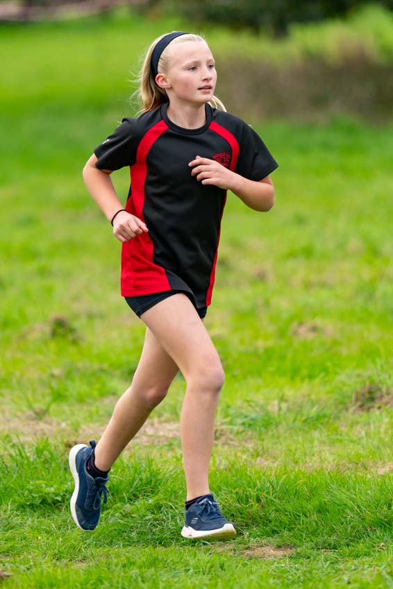 Brook Hill primary school girl in her stride at the Rutland cross country championships