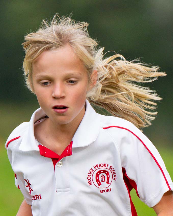 Primary school girl running for Brooke Priory in the cross county championships held at Rutland Water