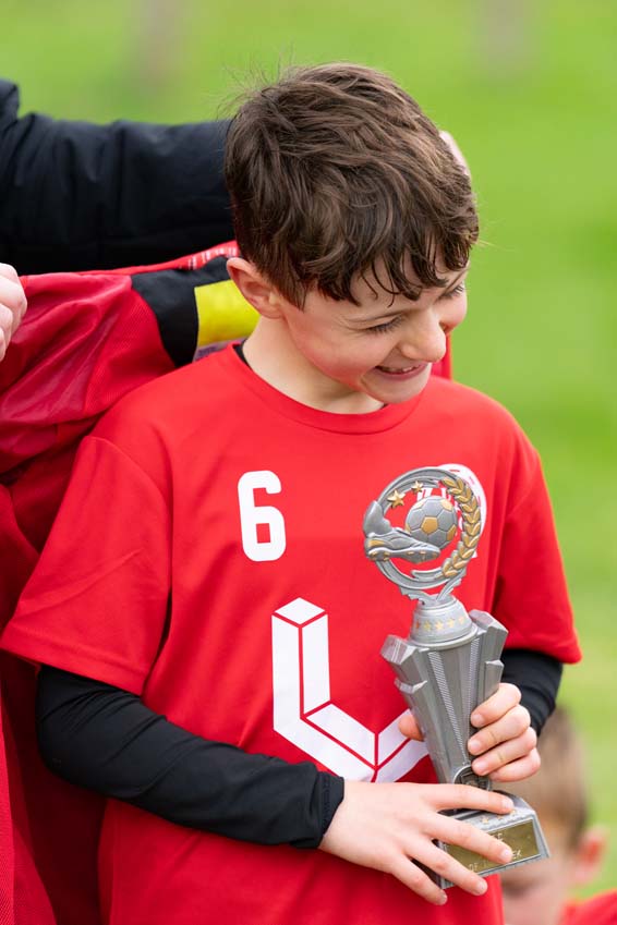 Uppingham Town Football Club junior receives player of the match award