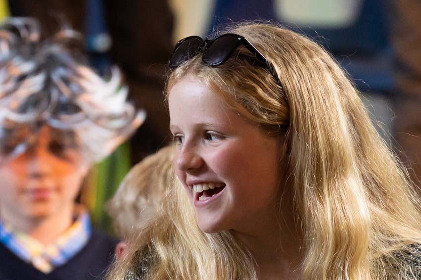 Having fun in a primary school performance of we're all going on a summer holiday Poplins