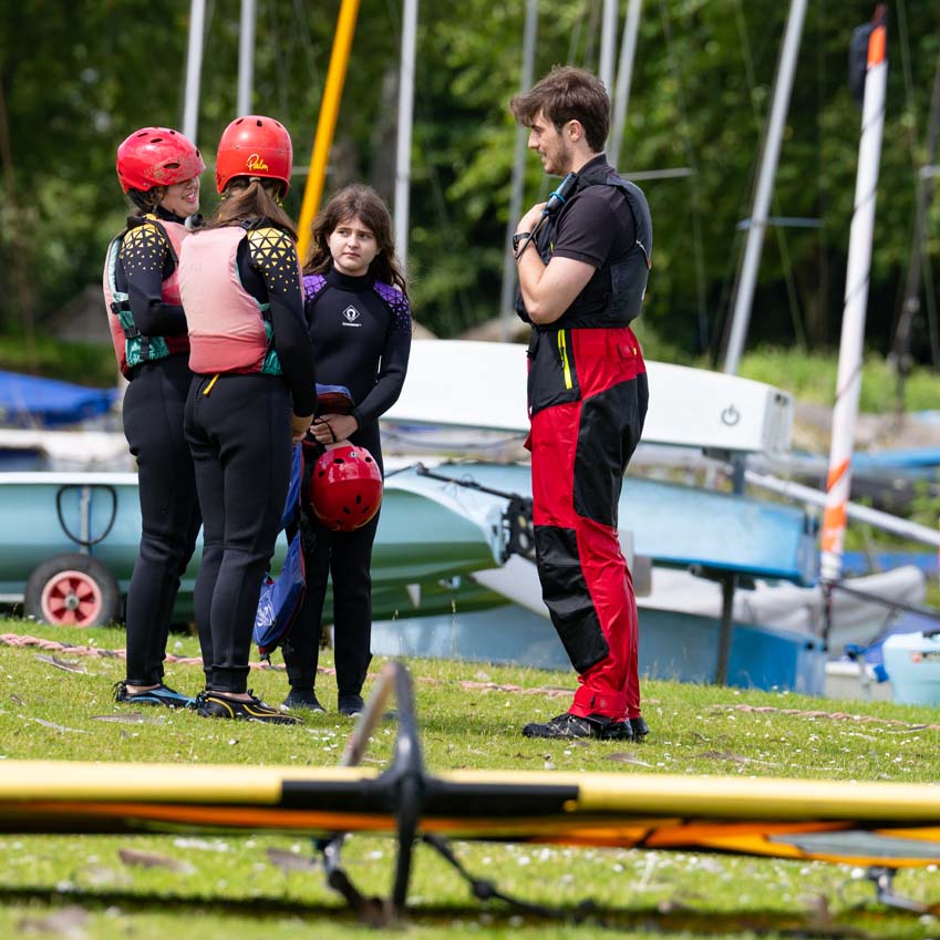 A Rutland Water Sailing School instructor speaking to the primary school children from SMSJ North Luffenham