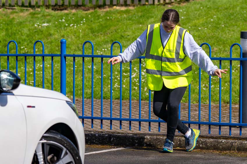 SMSJ Primary School hand car wash fundraiser directing traffic curtsy