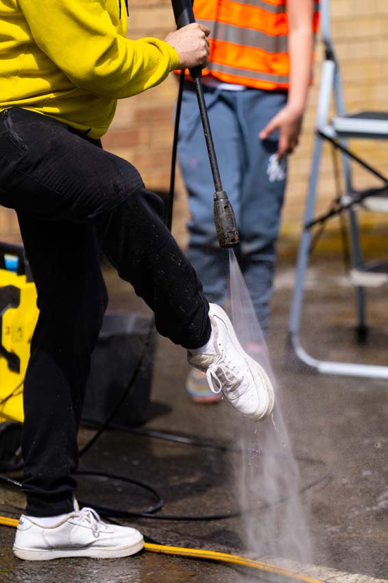 SMSJ Primary School hand car wash fundraiser parent pressure washing trainers