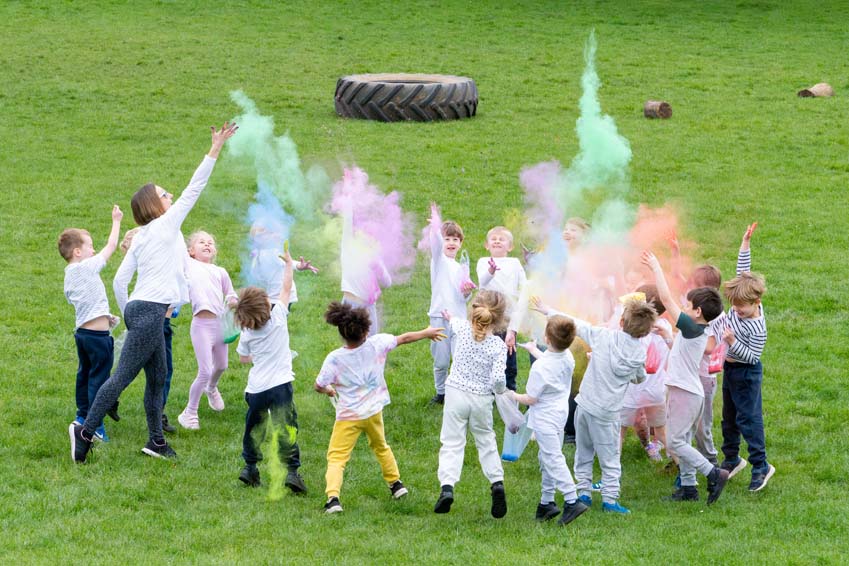 Hindi Holi Festival being celebrated with coloured powder thrown by the children at SMSJ North Luffenham primary school
