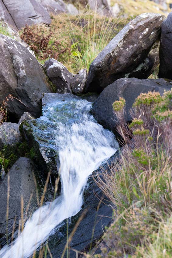 Slow shutter speed soft flowing effect on a small waterfall on Brandon Mountain in Co Kerry Ireland