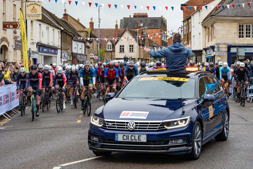 Colin Clews directing the race start at the Oakham to Melton Cicle Classic