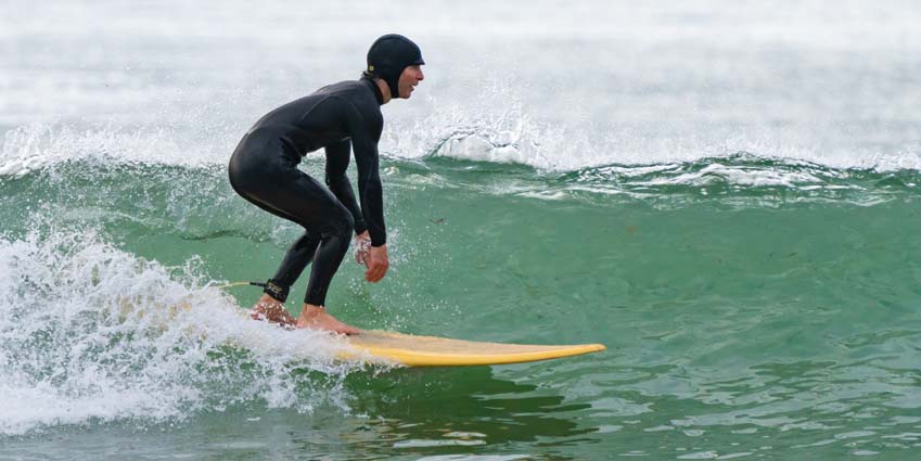 Rob Jones long board surfing in Brandon Bay, Ireland